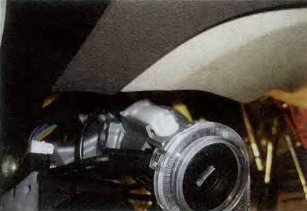 The white switch is the key travel switch located on the ignition switch